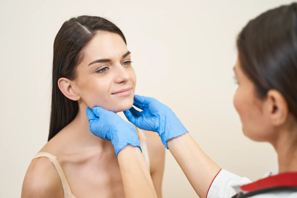woman examined by medical professional wearing blu 2026 03 20 00 03 30 utc