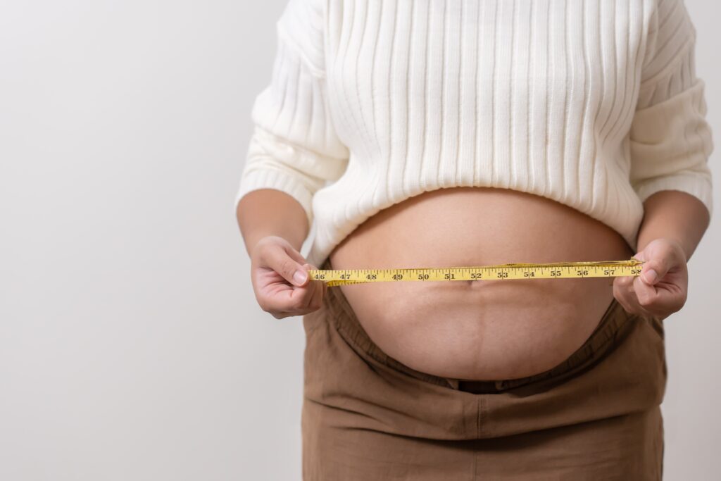 an obesity using measuring tape to show the real s 2025 01 07 04 44 03 utc min